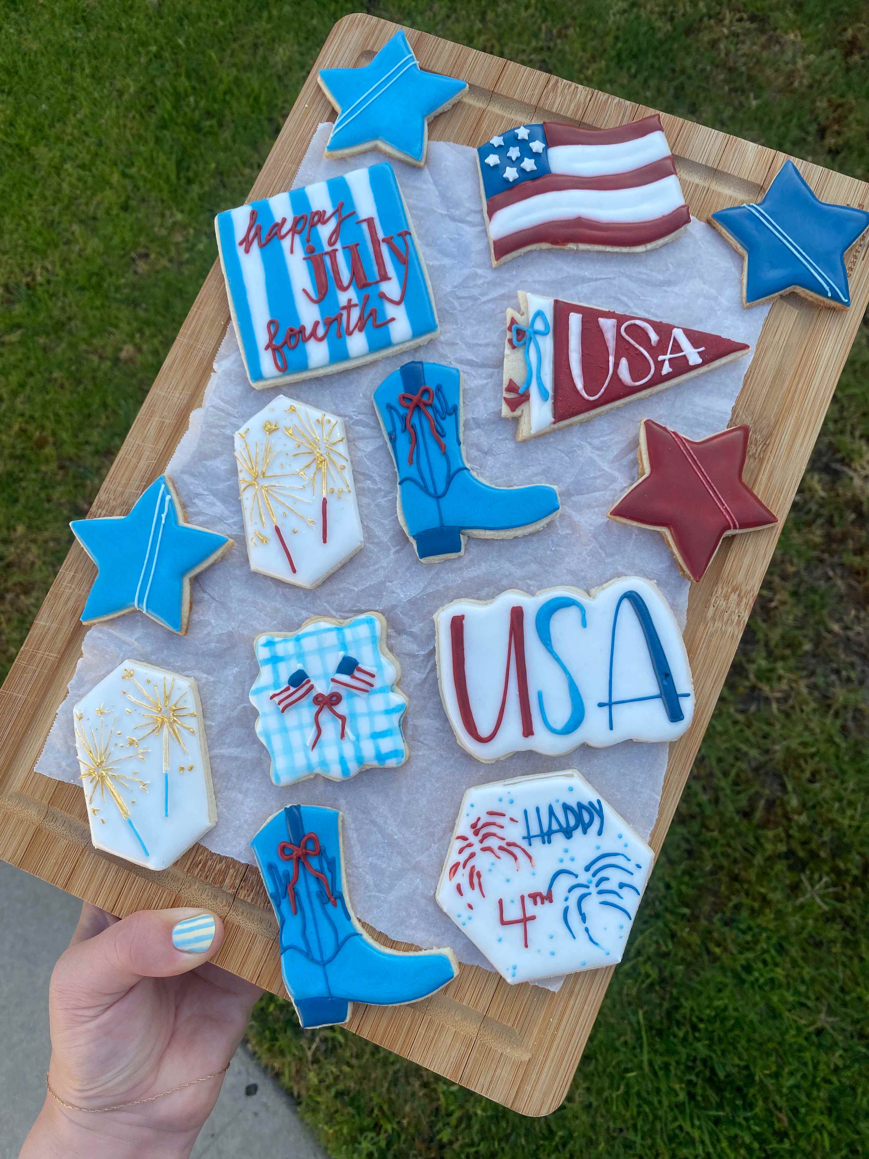 4th of July patriotic cookies with USA flags, stars, cowboy boots, and fireworks